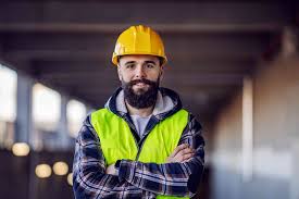 Lewis from St. John’s Carpets wearing builder’s gear, ready for a day of hard work on-site